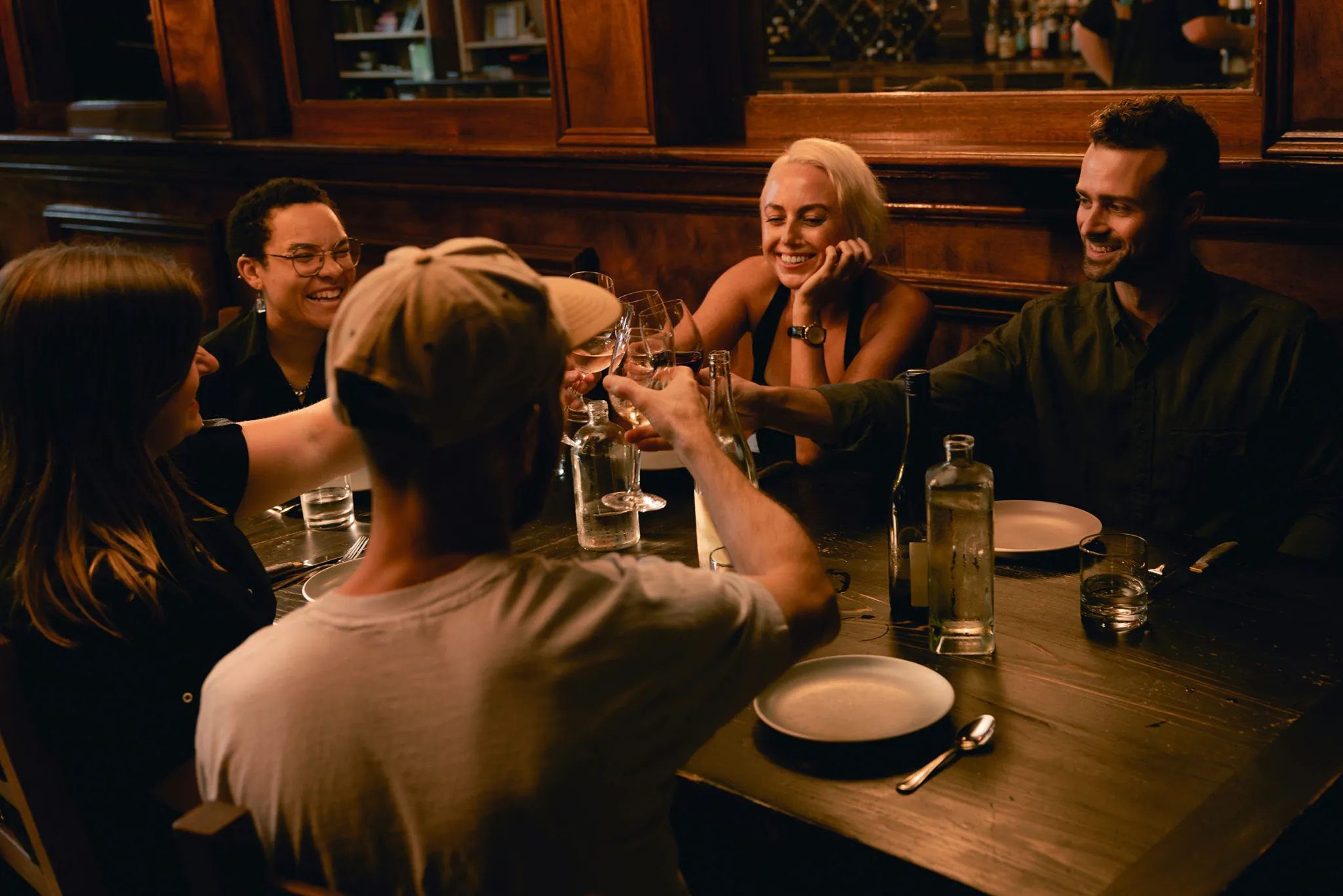Friends laughing together over dinner